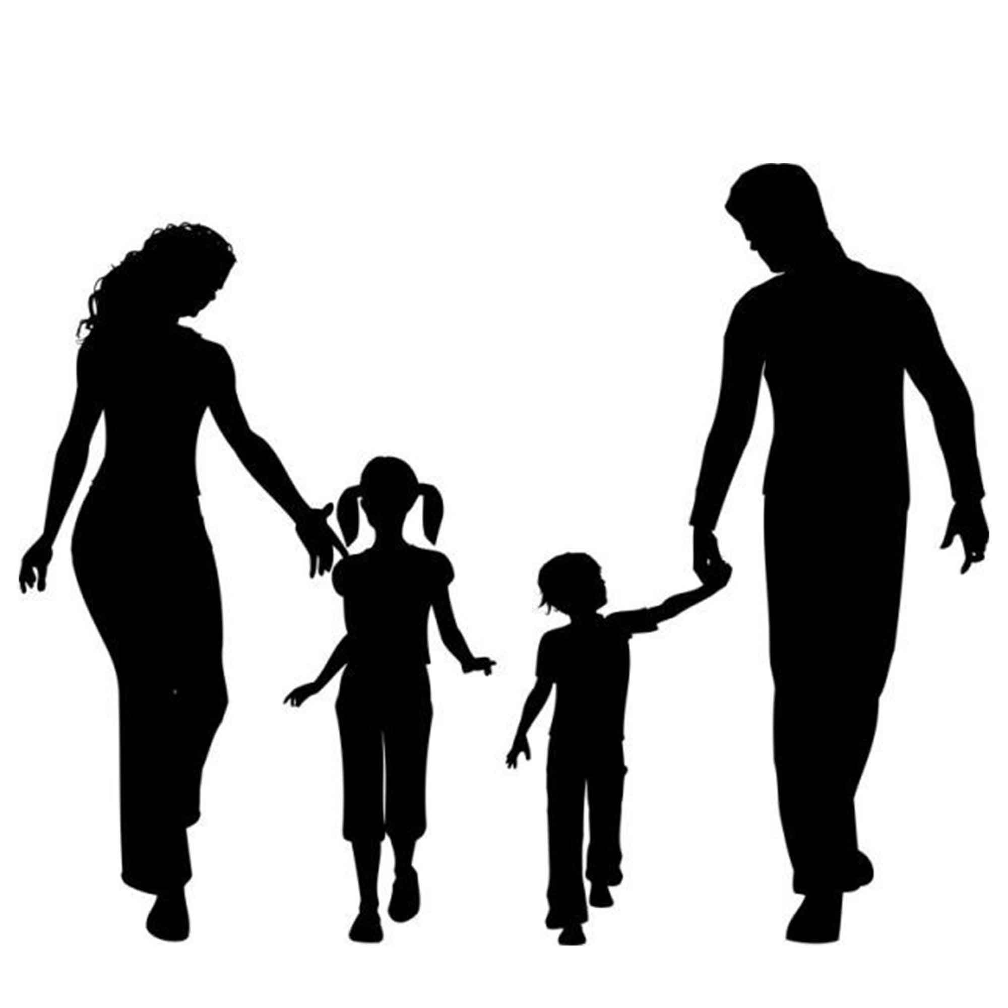 Silhouette of two adults and two children holding hands