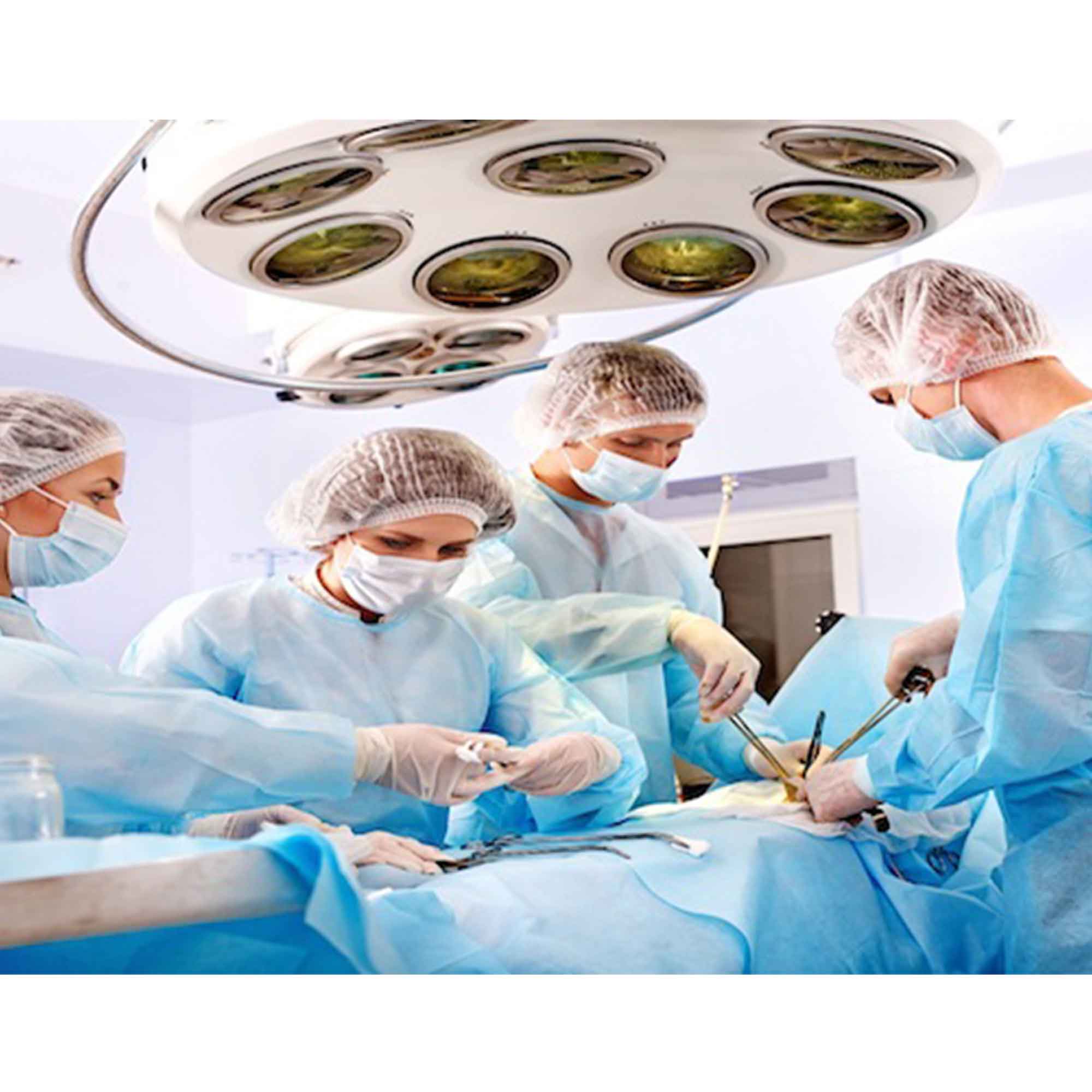 Surgical team wearing masks and gowns beneath operating lights