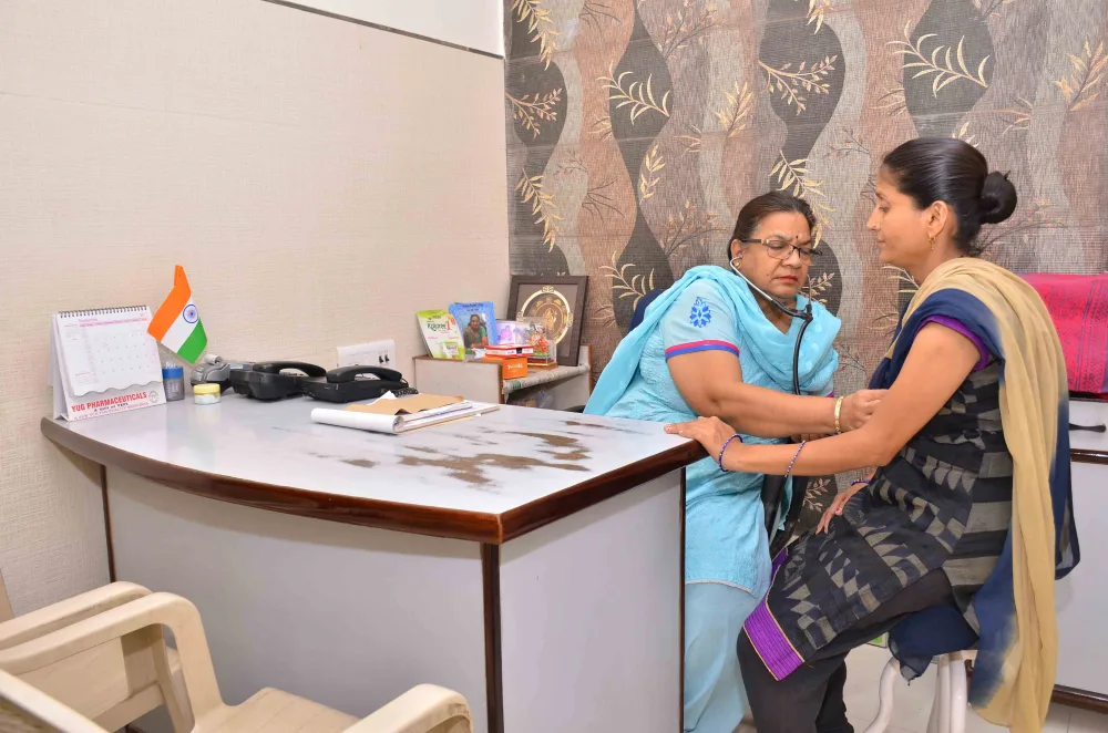 Doctor and patient seated across a consultation desk